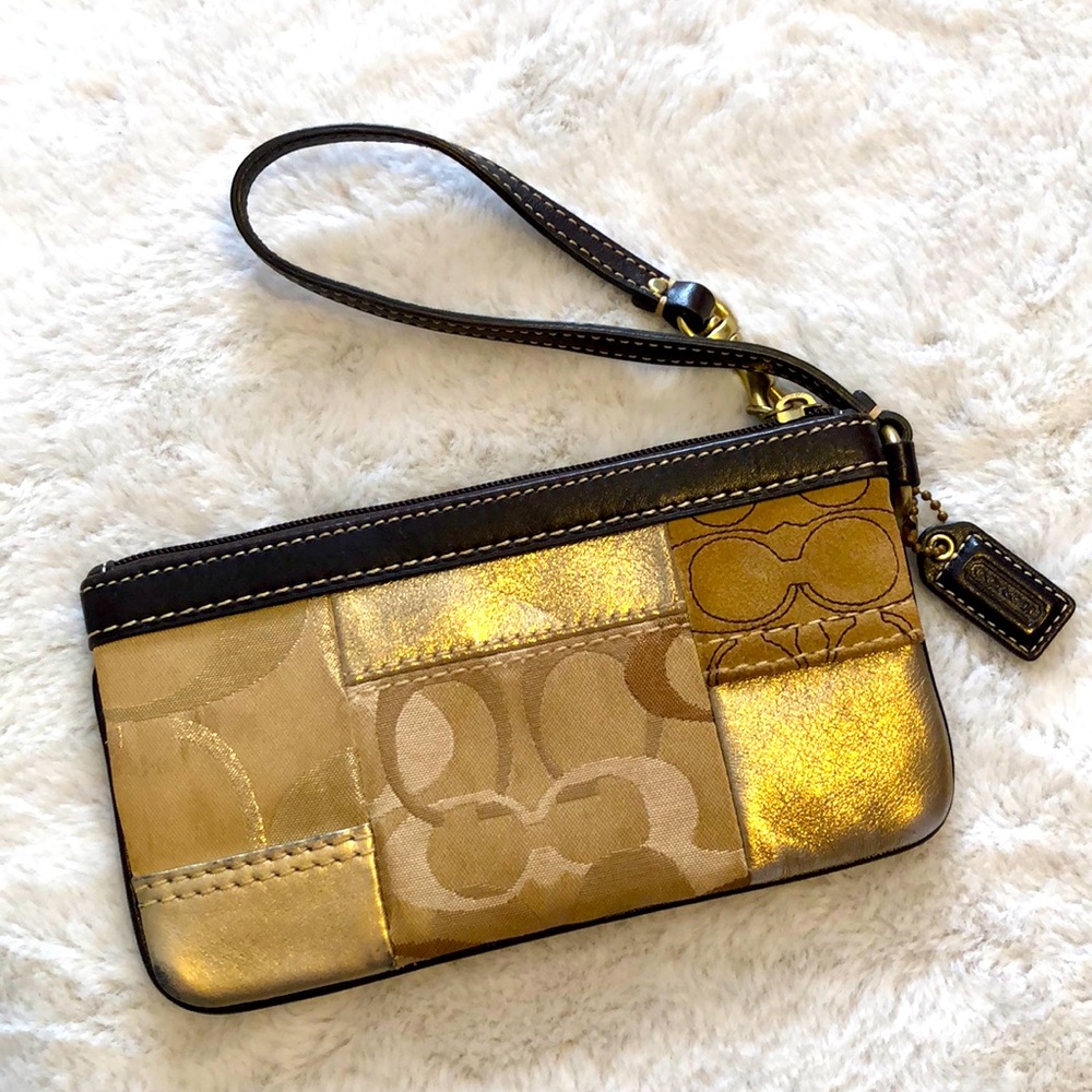 Gold and brown Coach wristlet
